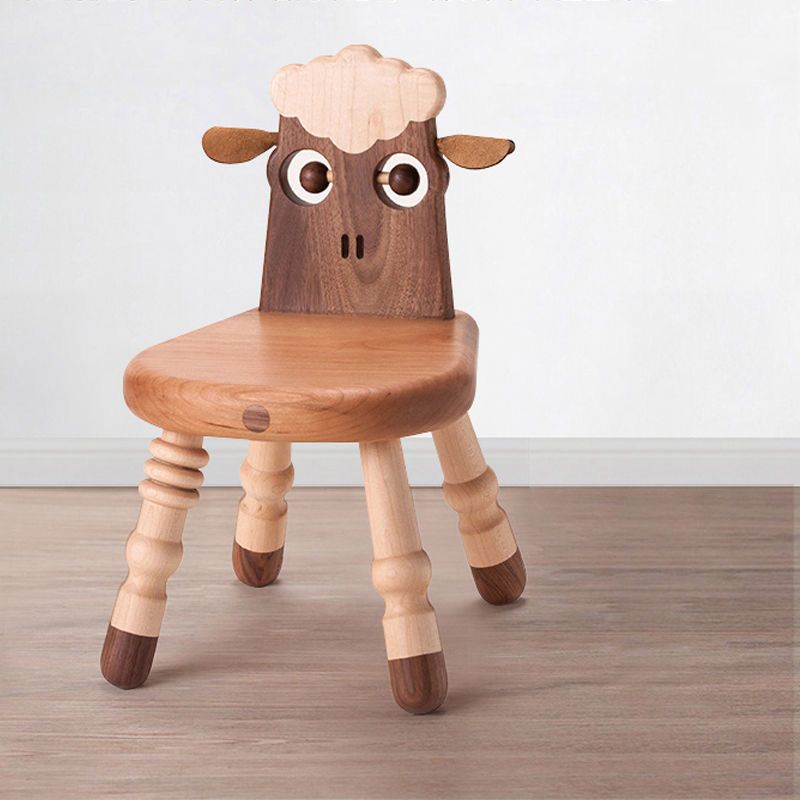 Wooden chair designed like a sheep on a wooden floor with a white wall background